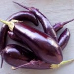 Purple eggplant in a bowl